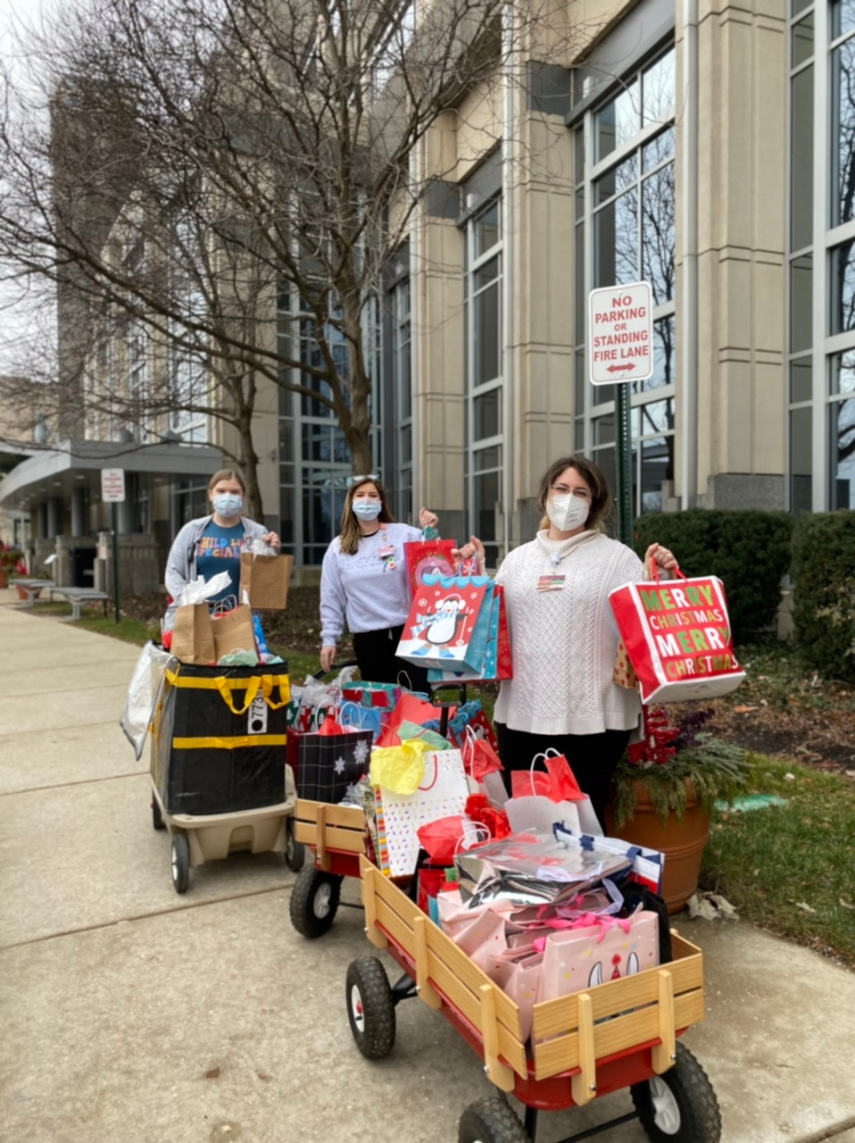 Staff delivering donations that the school collected for children in the hospital